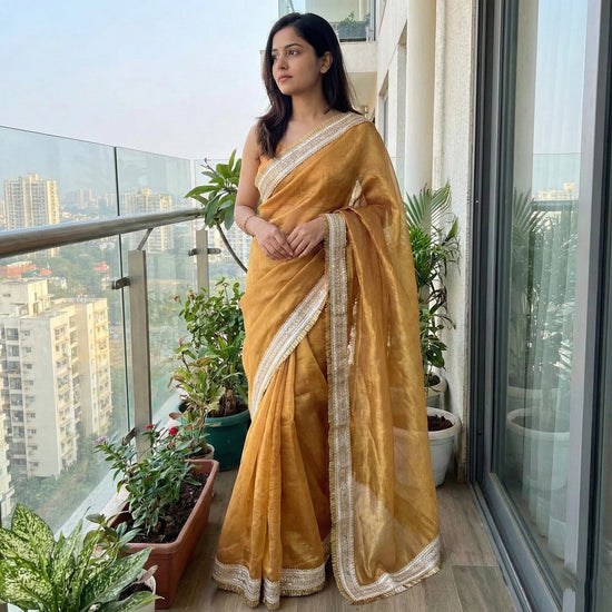 Golden Hour Shimmer saree drape – reflective gold border, radiant shimmer chiffon by Authority of Fashion
