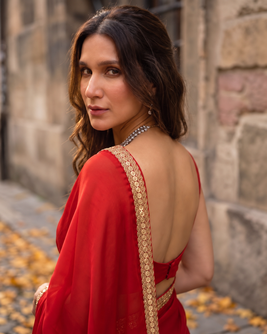 Scarlet Affair After Dark Saree — back view of the royal red saree with antique gold border and backless blouse