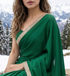 Woman in Sylvan Flow saree – deep green royal crepe for evenings that begin casually and end memorably