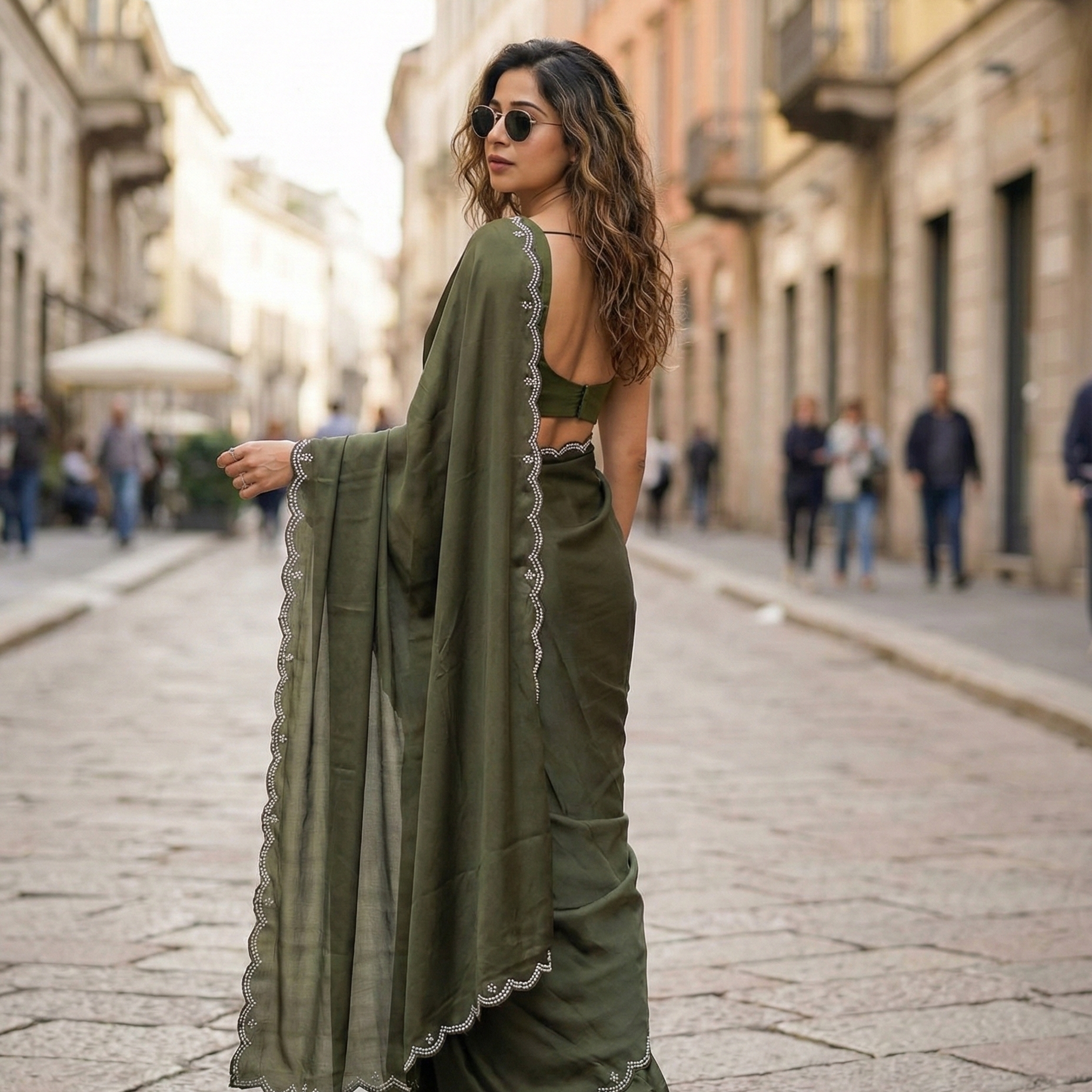 Woman in Verdant Grace saree – deep green royal crepe for luxury buyers and exclusive evenings