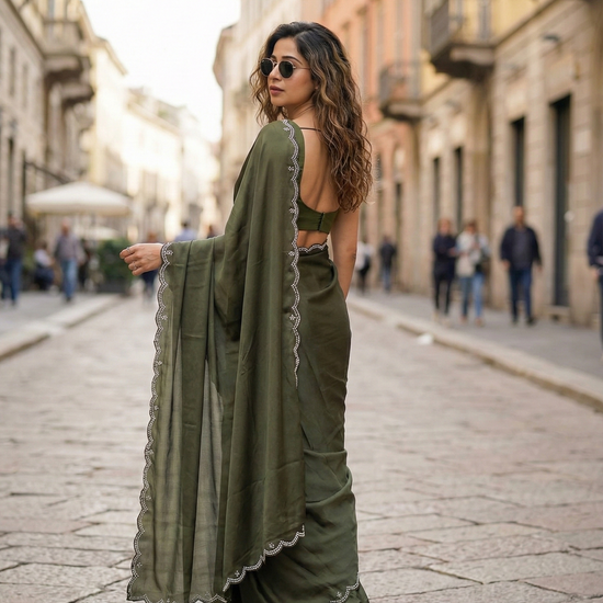 Woman in Verdant Grace saree – deep green royal crepe for luxury buyers and exclusive evenings