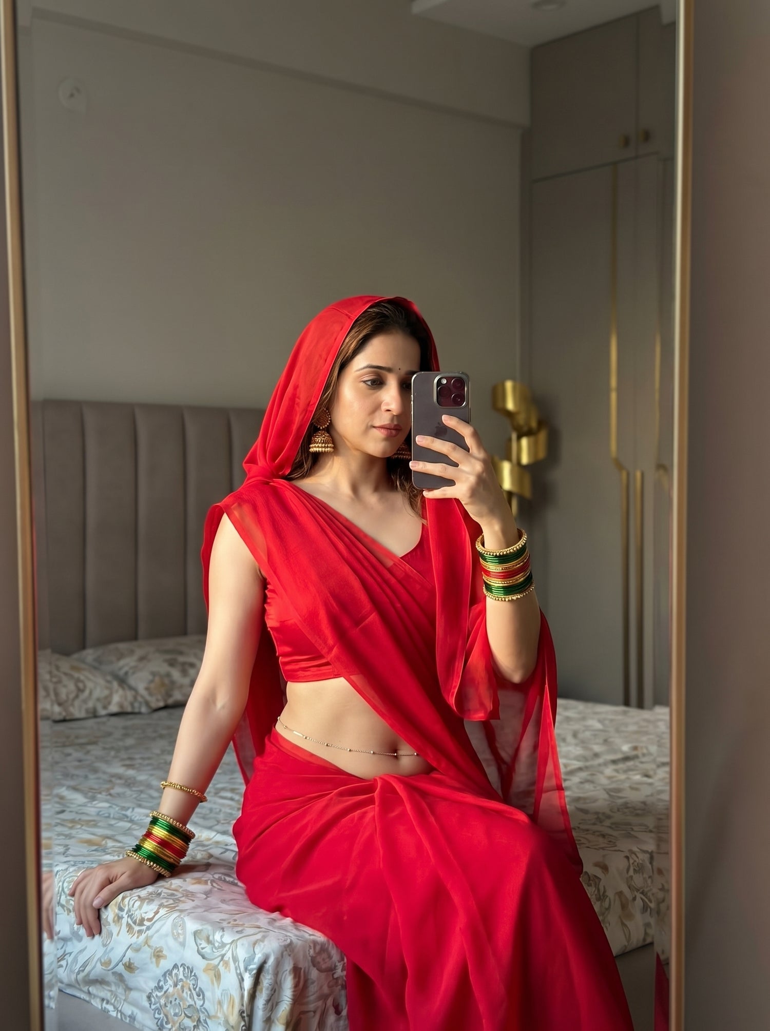 Velvet Temptation chiffon saree editorial – bold red After Dark saree with belly chain
