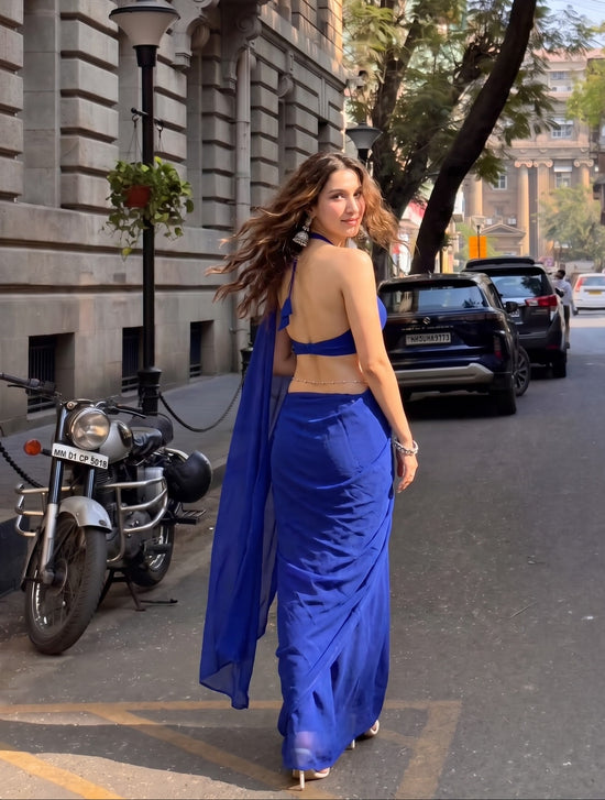 Woman walking in the royal blue Eclipse Allure After Dark Saree