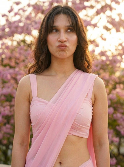 Woman in Cherry Bloom Chiffon Saree – baby pink chiffon saree, side profile