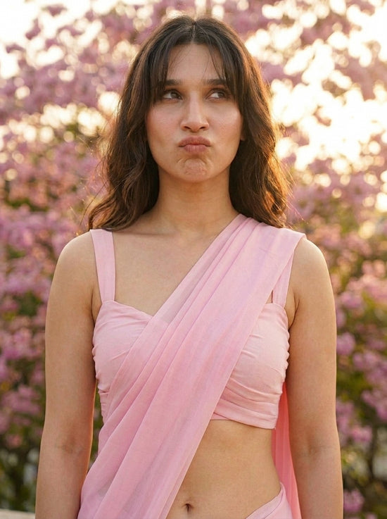 Woman in Cherry Bloom Chiffon Saree – baby pink chiffon saree, side profile