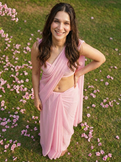 Woman smiling in Cherry Bloom Chiffon Saree – baby pink chiffon for daylight romance