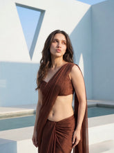 Close-up of woman in Cocoa Mirage brown chiffon saree, one-shoulder drape and sweetheart neckline