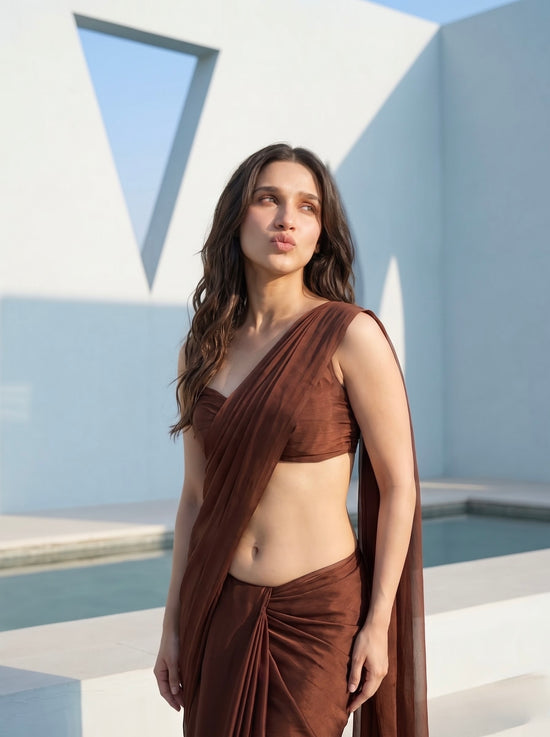 Close-up of woman in Cocoa Mirage brown chiffon saree, one-shoulder drape and sweetheart neckline