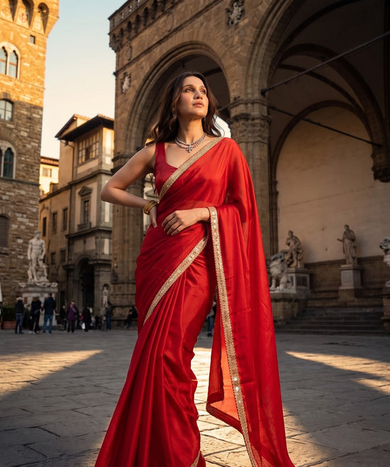 Woman posing in the Scarlet Affair After Dark Saree, royal red with antique gold border