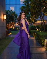 Woman turning in the Orchid Noir purple chiffon saree with the pallu in motion