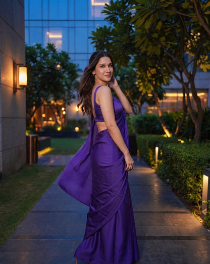 Woman turning in the Orchid Noir purple chiffon saree with the pallu in motion