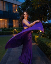 Woman twirling in the Orchid Noir purple chiffon saree